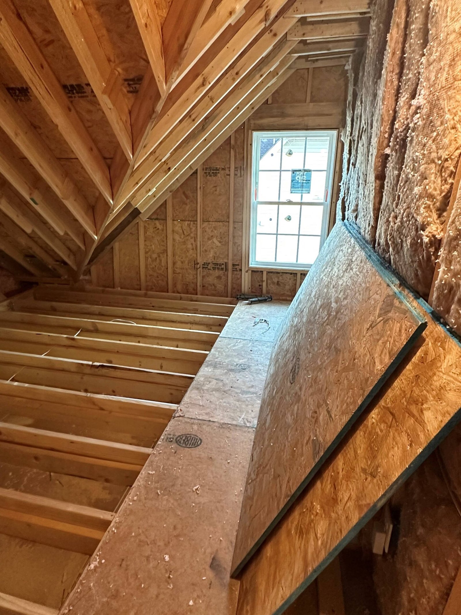 Residential construction framing with exposed beams and structural building work