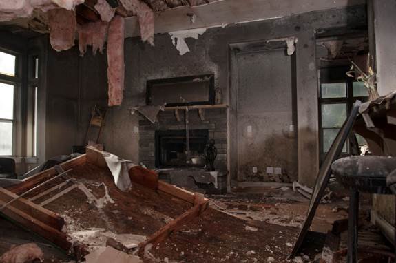 Fire damage restoration with charred framing smoke damage and structural repair work