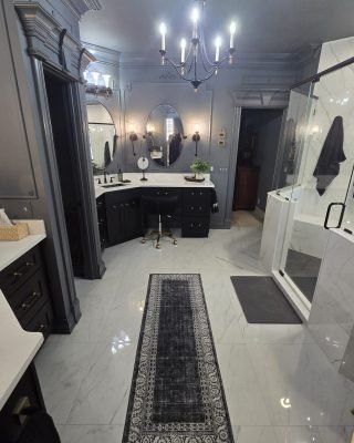 Bathroom remodeling with glass shower enclosure freestanding tub and modern lighting fixtures