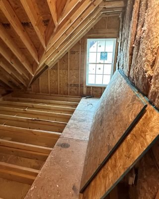 Residential construction framing with exposed beams and structural building work
