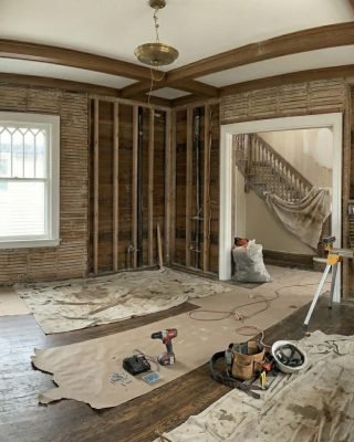 Home restoration project with exposed framing and interior structural repair work